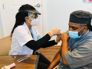 A Culpeper staff member receives his covid vaccine.