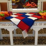 An afghan, handmade by Close Knits, was given to a veteran during a drawing held at the service.