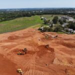 Aerial view of excavated grounds for future senior living cottages.