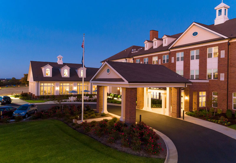 An exterior photo of the entrance of The Culpeper at dusk