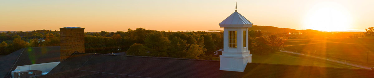 The roofline of The Culpeper at sunset