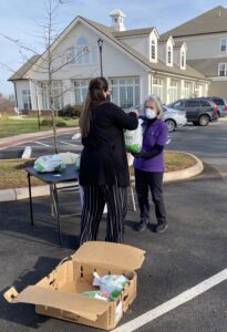 Residents at The Culpeper collect turkeys during a food drive.