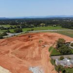 Aerial view of excavated grounds for future senior living cottages.