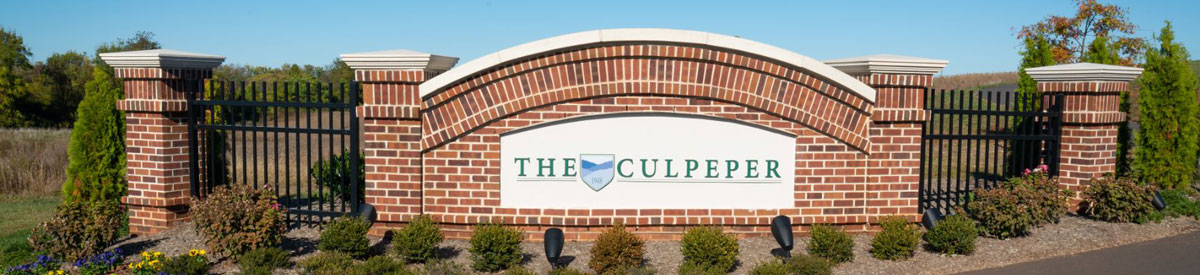 A photo of the brick welcoming sign to The Culpeper retirement community